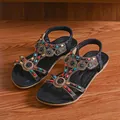 Ethnic style women's flat sandals with rhinestones and colorful beads on wooden floor - 36 / Coffee