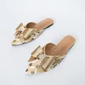 Elegante gouden platte muiltjes met puntige neus, grote strass-strik en luipaardmotief - 38 / Goud Plat