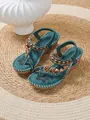 Detailed view of teal bohemian wedge sandals featuring intricate beadwork and heart charms - 36 / Dark Green