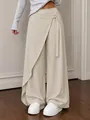 Elegant women's beige high-waisted wide-leg trousers with wrap front and belt. - S / Bottoms / Apricot