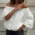 Stylish white off-the-shoulder cotton blouse with puff sleeves for a modern summer look - S / Tops / White