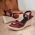 Side view of maroon suede wedge sandals with woven platform and ankle strap buckle - 38 / Burgundy