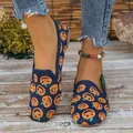 Detail of fly-knit women's loafers featuring orange pumpkin pattern on navy blue - Pumpkin Head