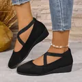 Detailed view of stylish women's black wedge shoes featuring comfortable elastic cross straps - 36 / Black