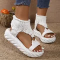 Detailed view of stylish white knitted platform sandals with metal ring accents - 36 / White