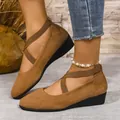 Detailed view of women's brown suede wedge shoes featuring elastic cross-over straps - 36 / Brown