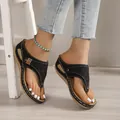 Detail view of retro platform wedge thong sandals with hollow patterns and white stitching - 35 / Black