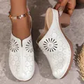 Detailed view of white women's closed-toe mules featuring laser-cut floral patterns - 36 / White (With Flowers)