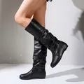 Detail of black slouchy knee-high boots with flat sole and round toe design - 35 / Flat Pad / Black
