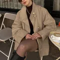 Women's stylish mid-length beige trench coat featuring a loose fit and bold button details - S / Tops / Khaki