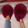 Detail view of fluffy burgundy faux fur slippers with a plush closed-toe design - Burgundy
