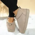 Cozy beige women's slip-on ankle snow boots with faux fur lining on fluffy white rug - 36 / Off White