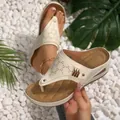Women's off-white wedge flip-flop sandals with hollow-out pattern and quilted footbed - White