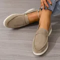 Detailed close-up of vintage women's frosted leather slip-on loafers in khaki - 35 / Camel