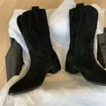 Detailed view of black suede western cowboy boots with intricate embroidery and V-cut. - 35 / Black