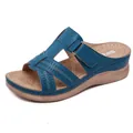 Detailed view of blue wedge sandals with cutout patterns and adjustable velcro strap - 36 / Blue