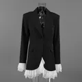 Detailed view of a black blazer jacket featuring elegant white lace trim on cuffs and hem. - S / Tops / Black