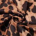 Close-up of soft leopard print knit fabric showing detailed texture and pattern. - S / Tops / Leopard Print