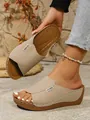 Close-up detail of beige platform wedge slides with stylish decorative stitching. - Off White