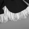 Detailed view of exquisite white eyelash lace trim on a black tailored blazer jacket - S / Tops / Black