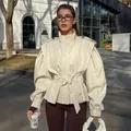Elegant French style cream trench coat featuring a waist tie and puff sleeves for women - S / Tops / Apricot