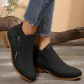 Stylish black women's ankle boots featuring block heel and side zipper detail on feet - Double Zipper Black