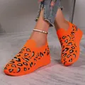 Detail view of vibrant orange leopard print fly-knit sneakers with thick wedge sole - 37 / Orange Leopard
