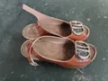 Elegant brown patent leather peep-toe slingback heels with large gold buckle - Tan