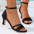 Detailed side view of black glitter peep toe sandals with an elegant gold buckle ankle strap - 36 / Black