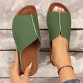 Detail of green wedge slide sandals showing the top cover and footbed design - Green