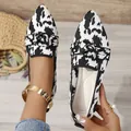 Stylish pointed-toe flats with black and white knit pattern and decorative buckle - Cow