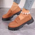 Macro view of stylish tan suede platform loafers featuring chunky black soles and slip-on design - 35 / Orange