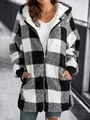 Detailed view of a cozy black and white checkered plush hooded jacket with zipper and pockets - S / Tops / Black