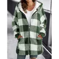 Detailed view showing the soft texture of a green plaid hooded plush jacket for women - Light Green