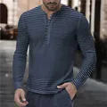 Close-up of men's long-sleeved horizontal striped Henley shirt in blue and black - S / Tops / Navy Blue