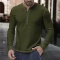 Detailed view of a casual men's green and black striped long-sleeve Henley T-shirt - S / Tops / Green