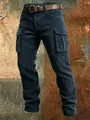 Men's navy corduroy cargo pants with slim fit and side pockets for outdoor wear. - Navy Blue