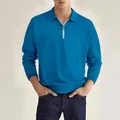 Detalle frontal de un polo de manga larga azul vibrante con cuello de cremallera plata - S / Tops / Azul zafiro