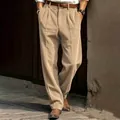 Detailed shot of men's loose corduroy straight-leg pants in khaki brown - Khaki