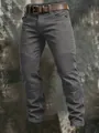 Detailed close-up of men's dark grey cotton cargo pants with pleated knee stitching - S / Bottoms / Gray