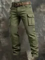 Detail of men's olive green tactical cargo pants showing pleated knee reinforcement and pockets. - 3XL / Bottoms / Army Green