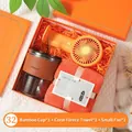 Coffret cadeau orange pratique avec tasse en verre, serviette en polaire corail et ventilateur - Gobelet en Verre Et Serviette Polaire Corail Et Mini Ventilateur / Boîte cadeau / Orange