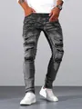 Detail view of men's distressed slim fit grey jeans with ripped and faded design elements - S / Bottoms / Silver Gray