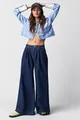Detail view of high-waisted dark blue wide-leg denim jeans with pleated waist for women. - XS / Bottoms / Dark Blue