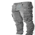 Detailed view of grey slim-fit cargo denim pants with multiple side pockets for men. - S / Bottoms / Gray
