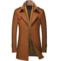 Detail view of camel wool overcoat featuring integrated geometric scarf collar. - 170/M / Tops / Yellow