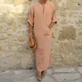 Detail of men's casual cotton linen long robe in salmon orange standing against stone wall - S / Robe / Hoodie Pocket Style / Orange