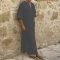 Detailed view of men's long cotton linen robe in dark grey against stone wall - S / Tops / Gray