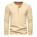 Detailed view of a classic beige men's long-sleeved Henley shirt with four-button placket. - Khaki