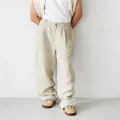 Full view of men's loose linen trousers with high-waisted pleated details for a relaxed look. - S / Bottoms / Khaki